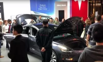 Hundreds-of-Tesla-fans-are-lining-up-outside-of-showrooms-to-check-out-the-Model-3